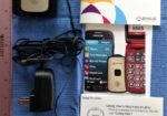 Great Call - device, user manual, quick start guide, and charger base.